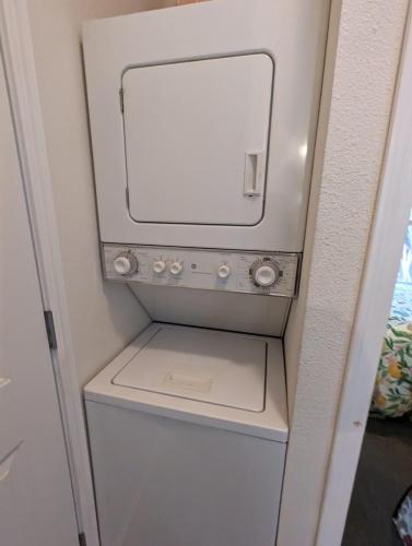 A washer and dryer in a small room.